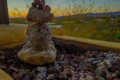 A small rock cairn at sunset