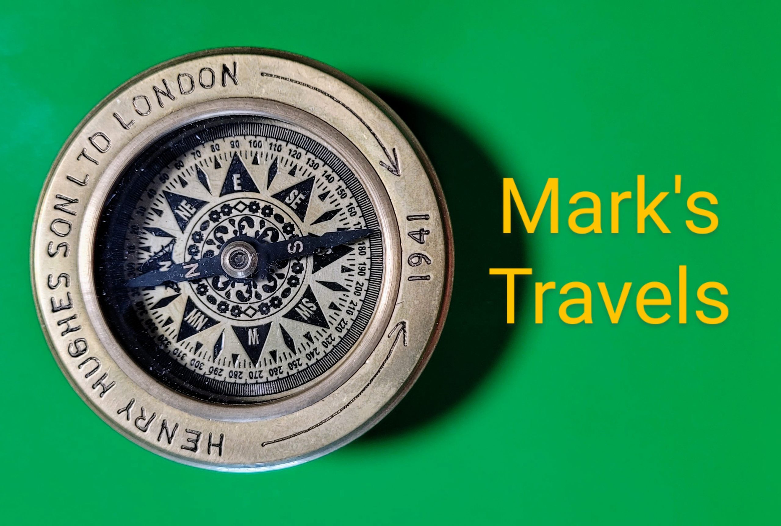 Antique compass with the words mark's travels